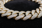 close up zoomed in pic of a gold cuban diamond plated chain