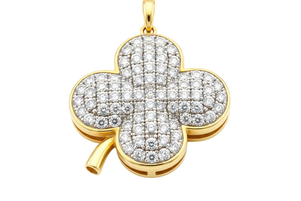 zoomed in picture of a diamond plated 4-clove pendant on gold base on white background